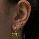 Load image into Gallery viewer, Bow Huggie Hoops

